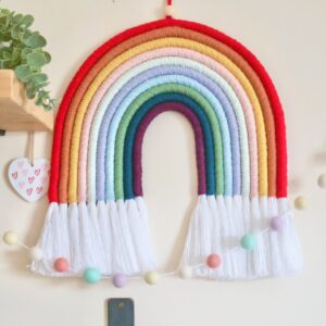 Vibrant 9-colour macramé rainbow wall hanging, perfect for nurseries, living rooms, or boho-inspired spaces