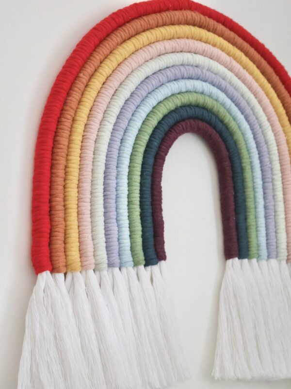 Vibrant 9-colour macramé rainbow wall hanging, perfect for nurseries, living rooms, or boho-inspired spaces